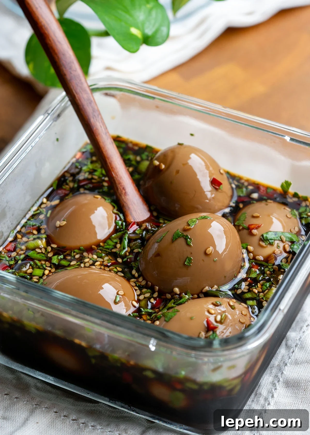 soft boiled eggs submerged in a soy sauce marinade