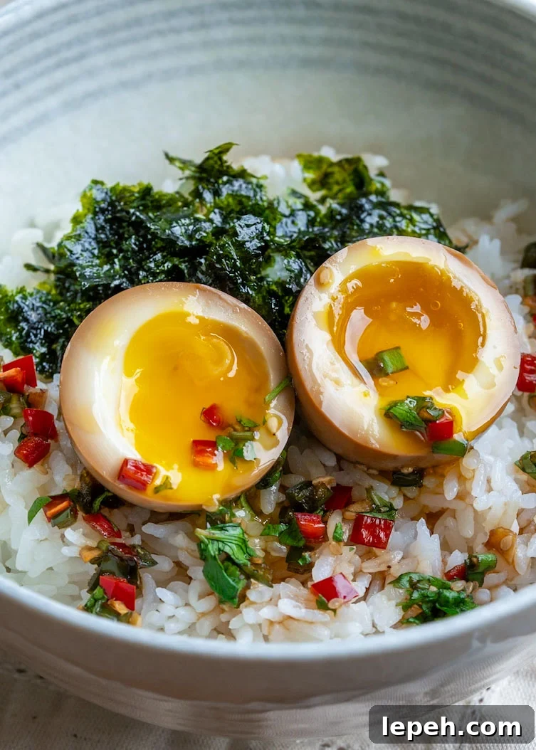 jammy mayak eggs over rice with roasted seaweed