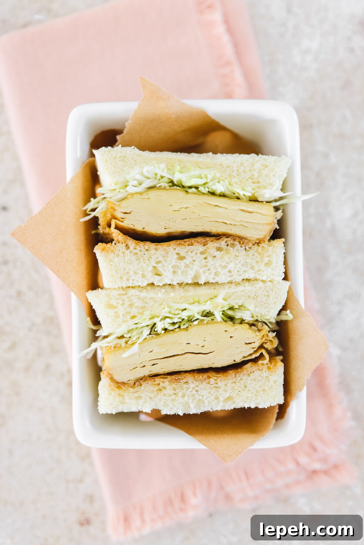 and overhead shot of a Japanese sandwich in a white serving tray